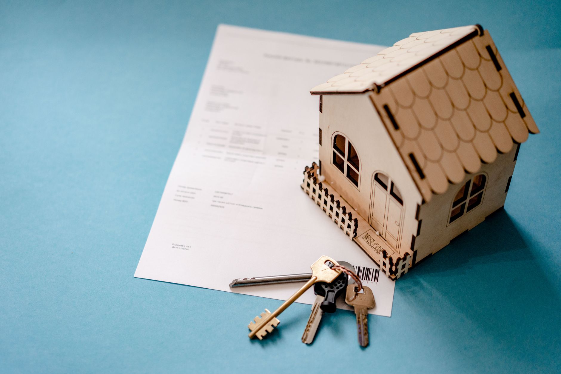 House keys resting on mortgage paperwork